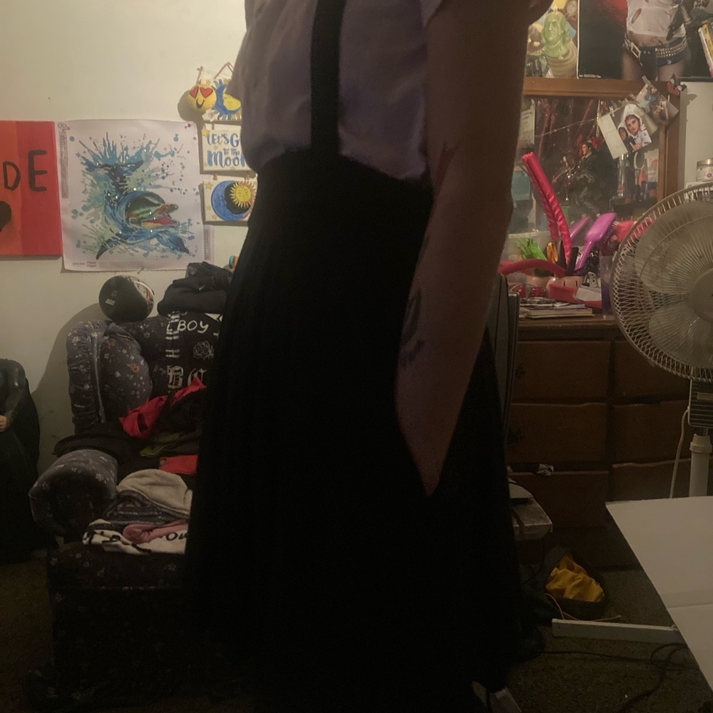 Skirt with suspenders size medium no tears has pockets